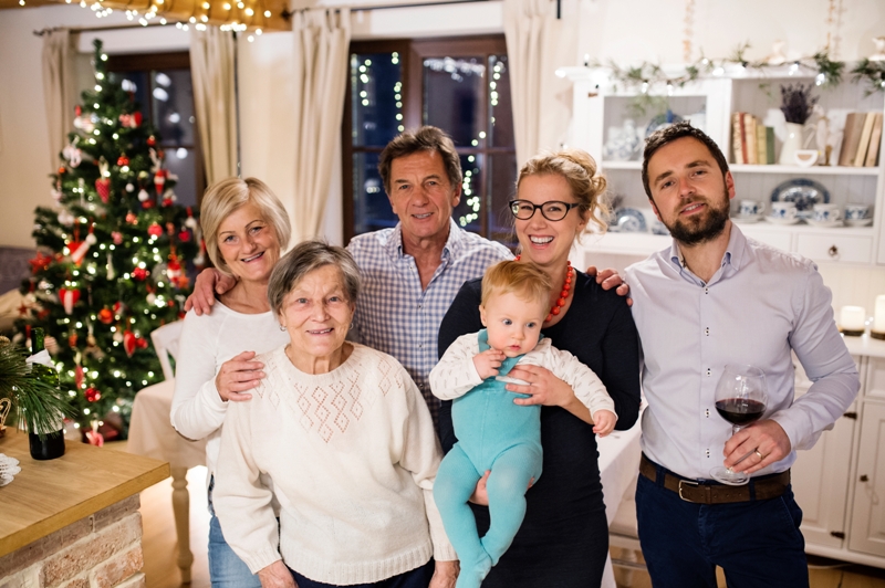 graphicstock beautiful big family celebrating christmat together at home illuminated christmas tree behind them BdWxtanHfb - 10 ways to be a fantastic daughter-in-law