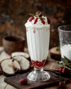 glass strawberry milkshake with strawberry pieces whipped cream 140725 4878 240x300 - How can banana shake help in weight gain?